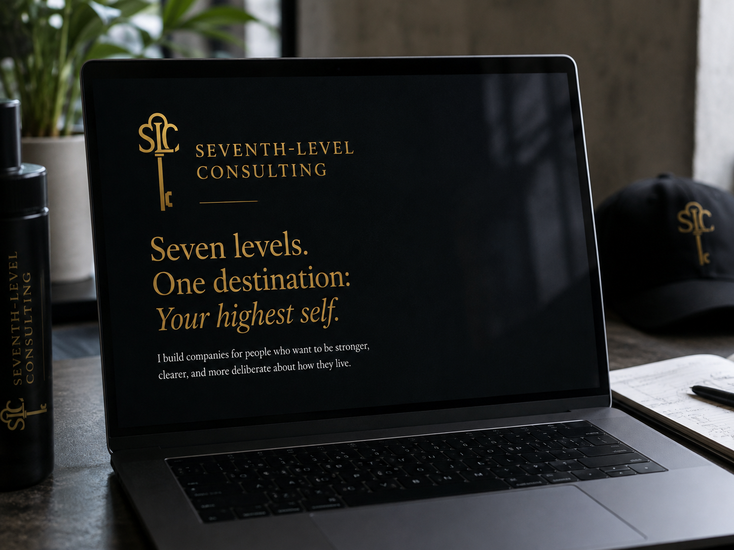 Seventh Level Consulting brand system on a workspace desk